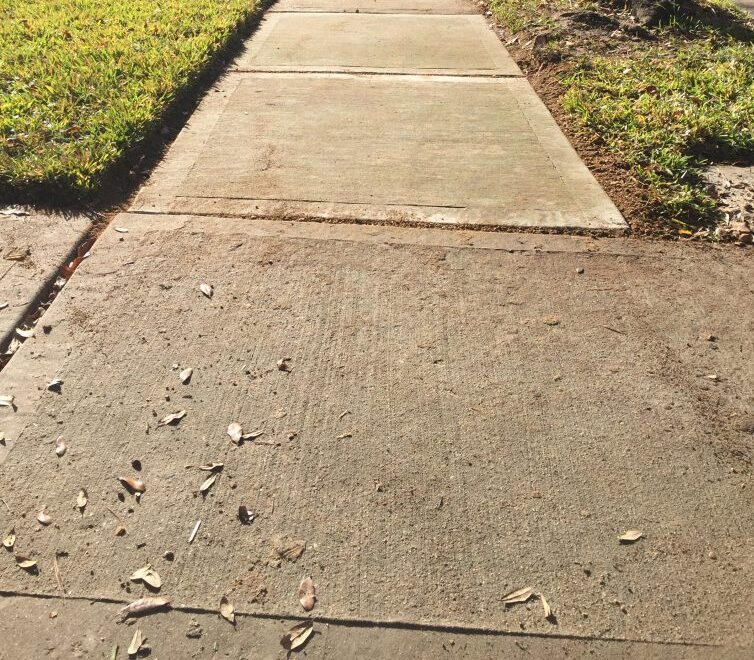 Image of Mr. Sidewalk's work. Concrete sidewalk raising and lowering repair needs.